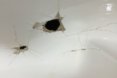 Holes in bath wall