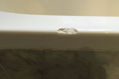 Chip to top edge of bath